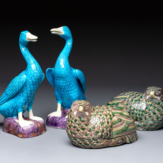 A pair of Chinese turquoise-glazed ducks and a pair of verte biscuit quail-form covered boxes, 20th C.