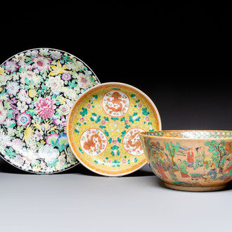 A Chinese famille rose 'Millefleurs' plate, a 'Dragons' plate, and a Nanking famille verte café-au-lait-ground bowl, Qianlong marks, 19/20th C.