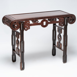 A Chinese elmwood console table, 19th C.