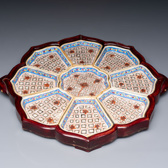 A Chinese famille rose nine-piece 'Plum Blossoms' sweetmeat set on a wooden tray, 19th C.