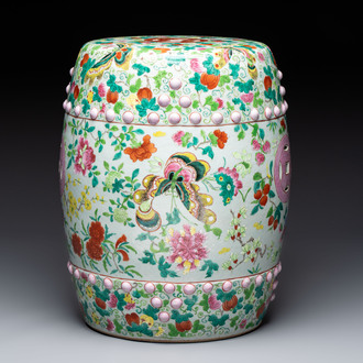 A Chinese famille rose garden seat with butterflies, flowers and fruiting branches, 19th C.