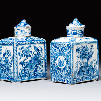 A pair of blue and white Dutch Delft square tea caddies and covers, 18th C.