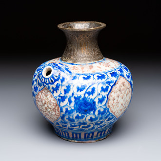 A Safavid blue, white and red pottery hookah base or kendi, Kirman, Persia, 17th C.