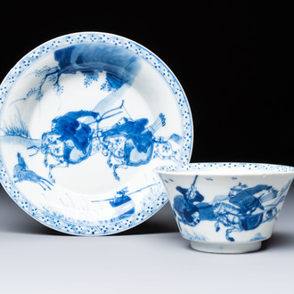 A Chinese blue and white 'Hunting Scene' cup and saucer, Kangxi