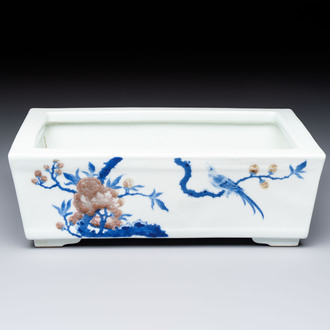 A Chinese blue, white and copper-red rectangular jardinière with birds among flowering branches, 20th C.