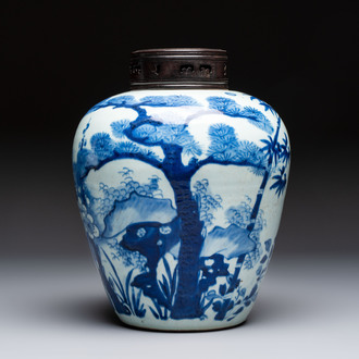 A Chinese blue and white 'Three Friends of Winter' jar with an openworked wooden cover, Transitional period