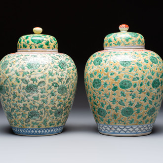 A rare pair of Chinese famille verte yellow-ground 'Flower Scroll' covered vases, Kangxi