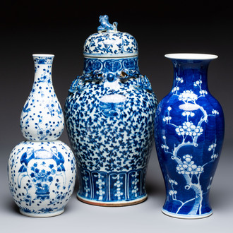 Three Chinese blue and white vases, one covered, Kangxi mark, 19th C. and later