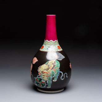 A rare Chinese famille verte black- and ruby-ground 'Buddhist Lions' vase, Kangxi