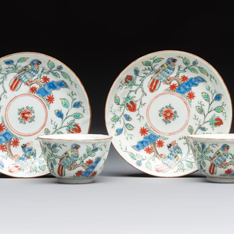 Two Chinese Dutch-decorated cups and saucers with parrots among flowering branches, 18th C.