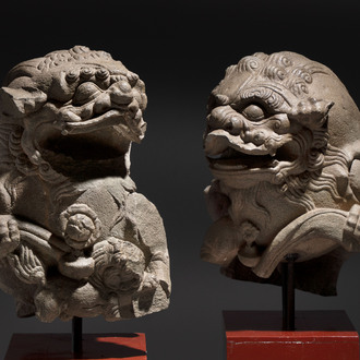 A pair of Chinese carved stone Buddhist lions on later red-lacquered wooden stands, Fujian, Qing