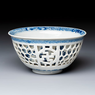 A Chinese blue and white reticulated double-walled 'Swastika' bowl, Kangxi