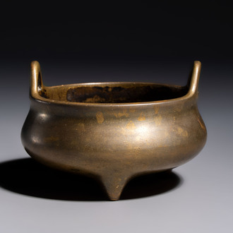 A Chinese bronze two-handled tripod censer, Xuande mark, 19th C.