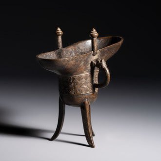A Chinese archaistic bronze ritual wine vessel, Jue 爵, Qianlong mark, dated 1738