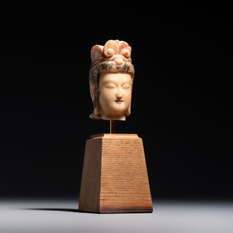 A rare Chinese polychrome carved white marble head of a Bodhisattva on a stand, Northern Qi