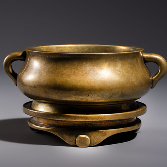 A fine Chinese bronze censer with loop handles and stand, Xuande mark, 18th C.