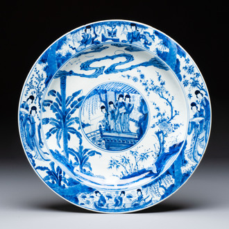 A fine Chinese blue and white 'Elegant Beauties' dish with raised central medallion, Kangxi