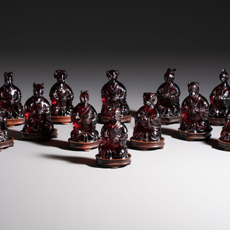 A rare complete set of 12 Chinese cherry amber 'Zodiac' figures on wooden stands, Qianlong mark, Republic
