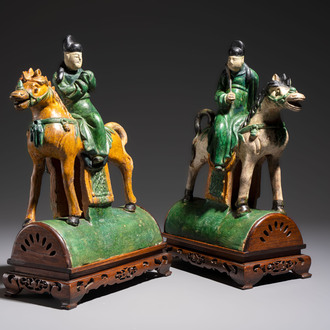 A pair of Chinese sancai-glazed 'Horseriders' roof tiles on wooden stands, Ming