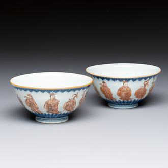 A pair of Chinese blue and white iron-red-decorated 'Three Star Gods' bowls, Qianlong mark and of the period