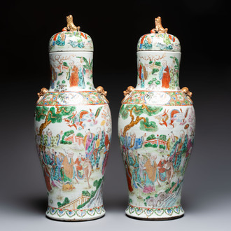 A pair of Chinese famille rose '18 Luohan' vases and covers, 19th C.