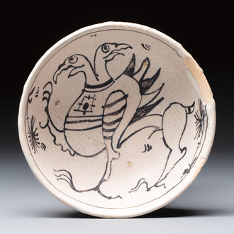 An unusual early Italian maiolica bowl with a two-headed mythical bird, 15th C.