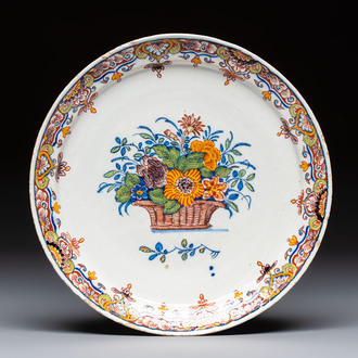 A fine polychrome Dutch Delft 'Flower Basket' plate, 18th C.