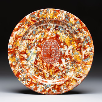 A highly unusual Italian faux marble-splashed armorial pottery dish, 17th C.