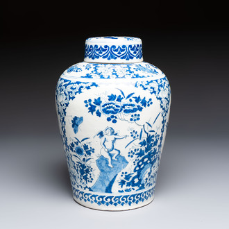 A refined blue and white Dutch Delft jar and cover with a putto on a rock, late 17th C.