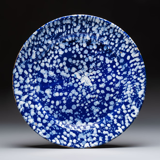 A rare large Nevers white-splashed blue-ground 'à la bougie' dish, France, late 17th C.