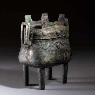 An inscribed Chinese archaic bronze food vessel and cover with double-dragon design, 'Yu Fang Ding 圉方鼎', Western Zhou