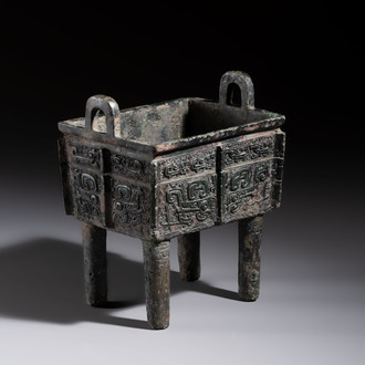 An inscribed Chinese archaic bronze food vessel with Taotie design, Ding 鼎, Western Zhou