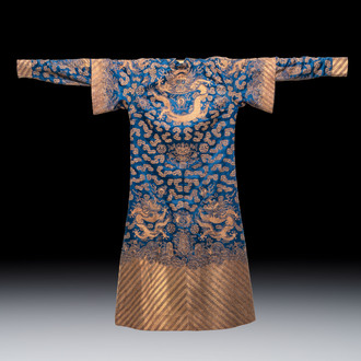 A Chinese embroidered silk blue-ground 'Dragons' robe, adapted into a lady's dress, 19th C. and later