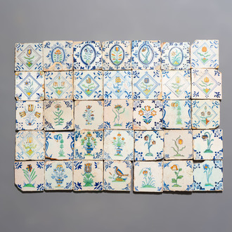 35 polychrome Dutch Delft tiles with varied floral designs, 17th C.