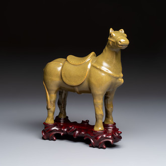 A Chinese teadust-glazed model of a horse on a wooden stand, Republic