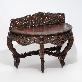 A finely carved Anglo-Indian rosewood demi-lune console table with lions, 19th C.