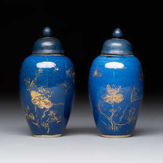 A pair of Chinese gilt-decorated powder-blue-ground miniature vases and wooden covers, 18th C.