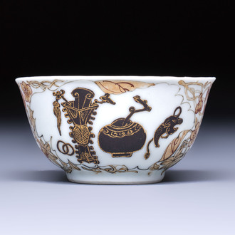 A Chinese gilt-decorated black-enamelled 'Antiquities' cup, Yongzheng/Qianlong