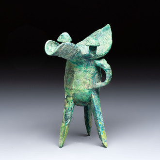 A Chinese archaic bronze wine vessel with Taotie design, Jue 爵, late Shang