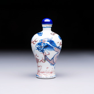 A Chinese blue, white and copper-red 'Dragon' snuff bottle, 19th C.