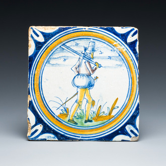 A polychrome Dutch Delft maiolica 'Soldier' medallion tile, 16th C.