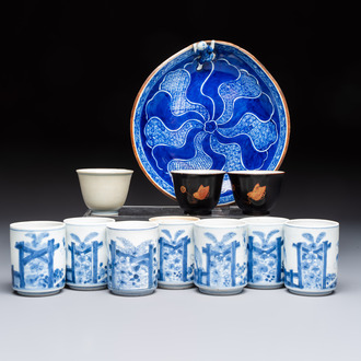 A Japanese blue and white plate, eight cups, and two gilt-lacquered porcelain cups, 19/20th C.