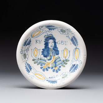 A rare polychrome Dutch Delft 'King William' dish, inscribed 'KV GBT', 17th C.