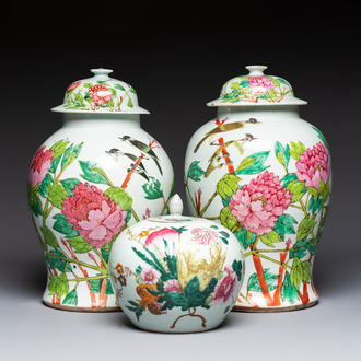 Two Chinese famille rose 'Birds among Flowering Branches' covered vases and a covered jar, 19/20th C.
