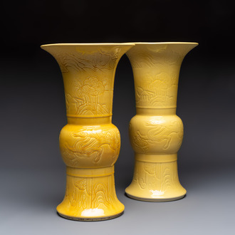 A pair of Chinese yellow-glazed 'Gu' vases with incised chilongs and landscapes, Chenghua mark, 20th C.
