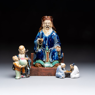 A Chinese polychrome-glazed Shiwan stoneware figure of Tudigong, a 'Shoulao' group and a 'Go Players' group, China marks, 19/20th C.