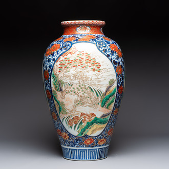 A large Japanese Imari 'Shishi Lions' vase, Kutani Taniguchi 九谷 谷口 mark, Meiji, 19th C.