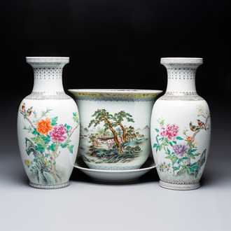 A Chinese famille rose 'Mountainous Landscape' jardiniere with a stand and a pair of vases with floral design, Qianlong marks, 20th C.