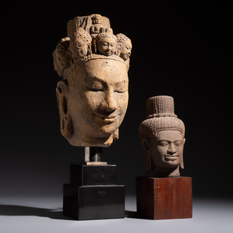 A Khmer-style carved stone head and a carved stone head of a deity, Thailand and Cambodia, 20th C. or earlier