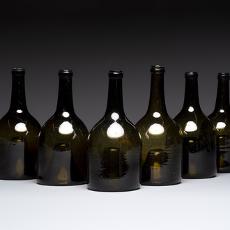 A set of six dark green glass mallet-shaped bottles, possibly France or England, 19th C. or earlier